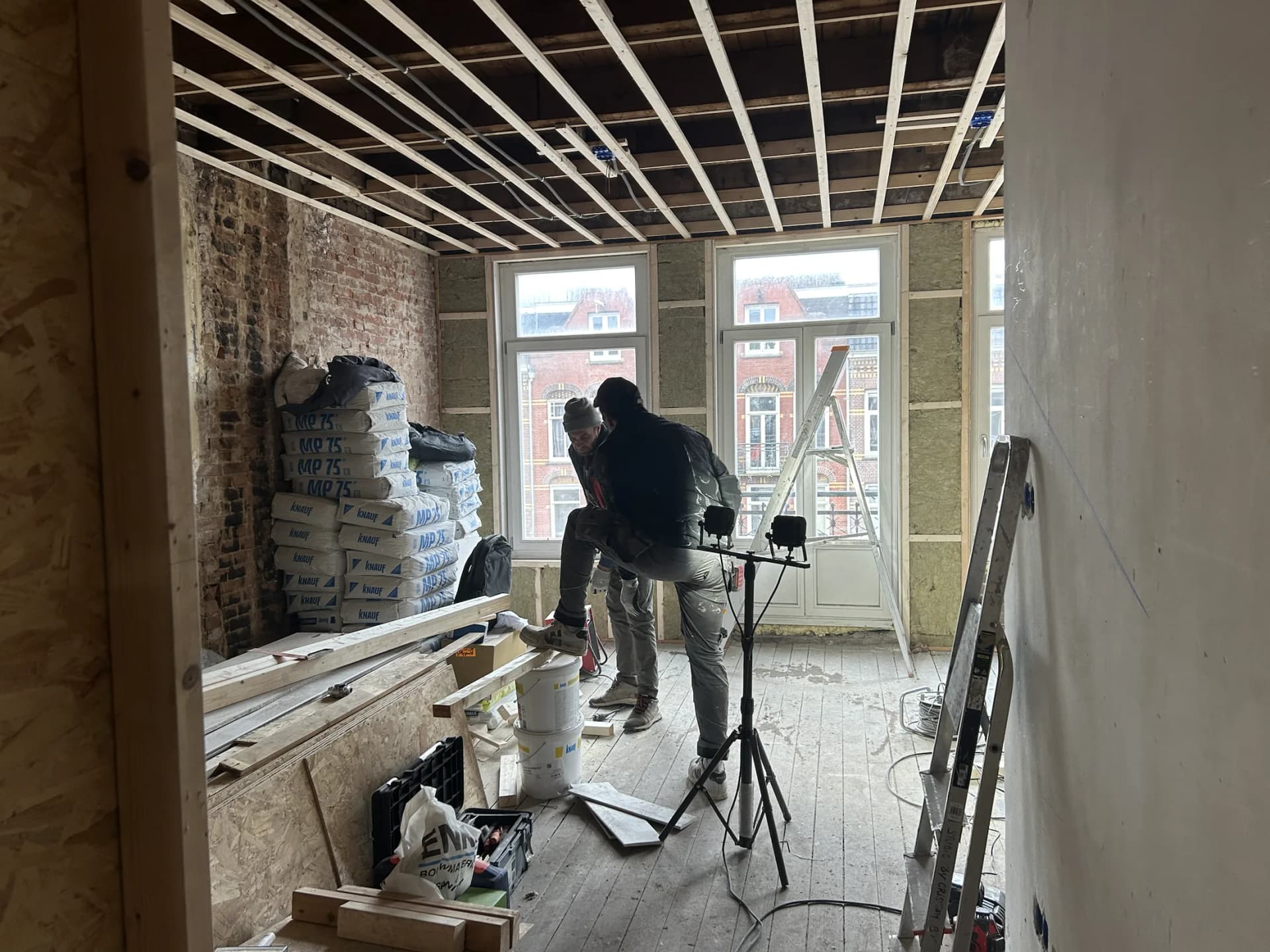 Exposed structure and construction team during the Amsterdam duplex transformation
